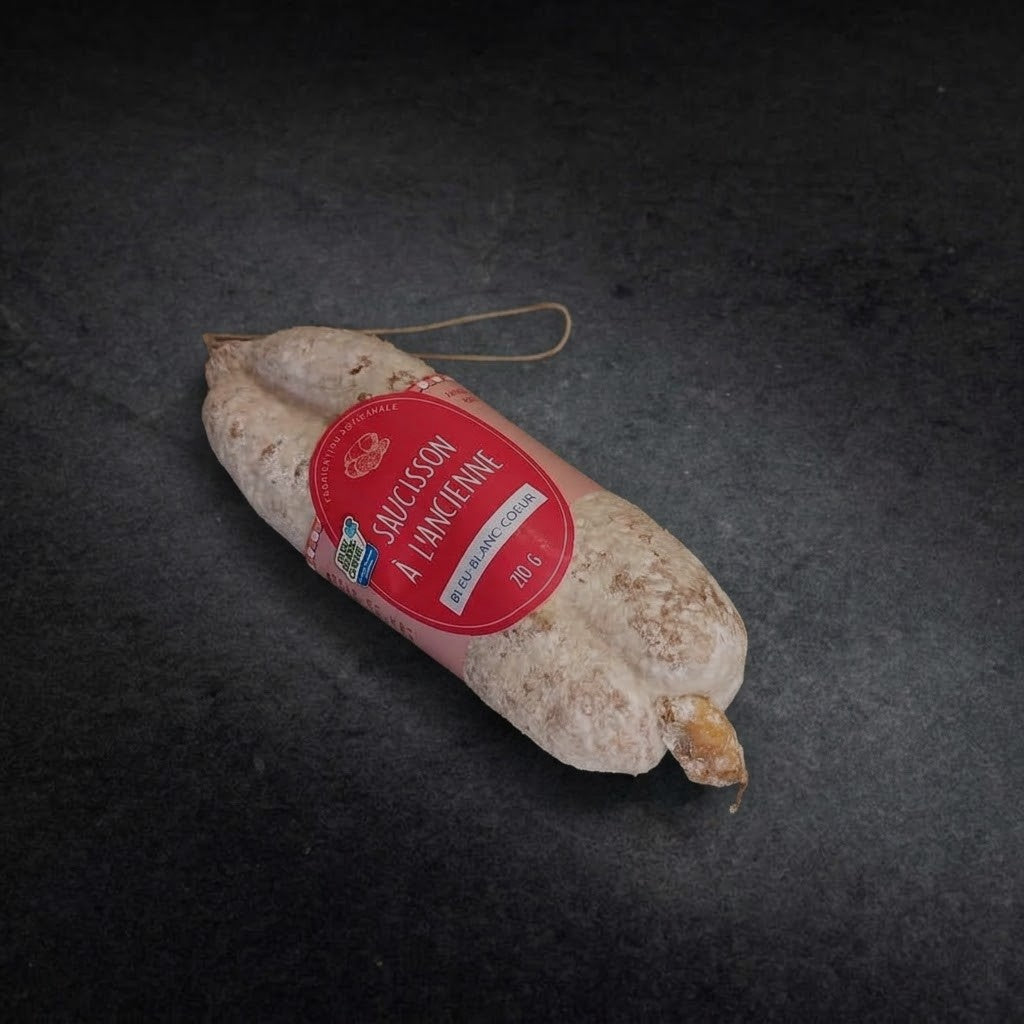 Old-style Bleu-Blanc-Coeur dry-cured saucisson, 210 g, with its label on a dark grey background