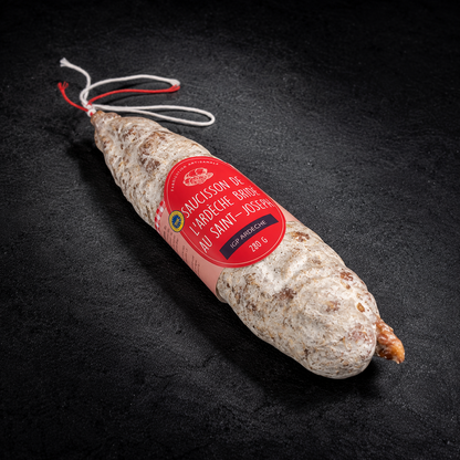 Hand-tied Saint-Joseph red wine saucisson, Ardèche PGI, 280 g, with its label on a black slate background