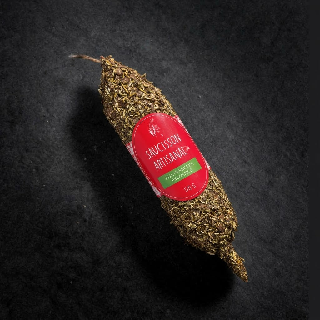 Artisan dry-cured saucisson coated in herbes de Provence, 170 g, with its label on a black slate background